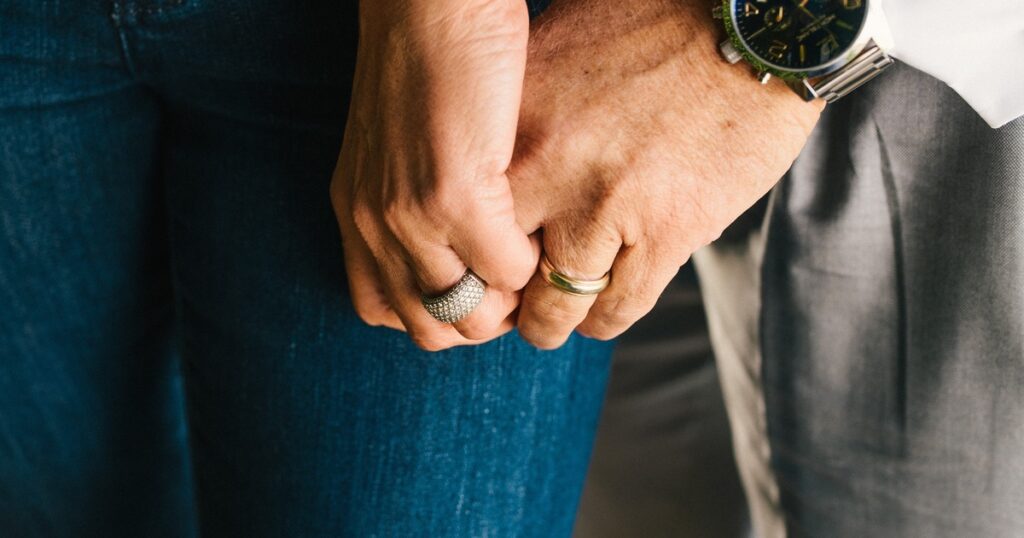 Anne and Brian Bercht holding hands after rebuilding trust and healing their marriage after infidelity