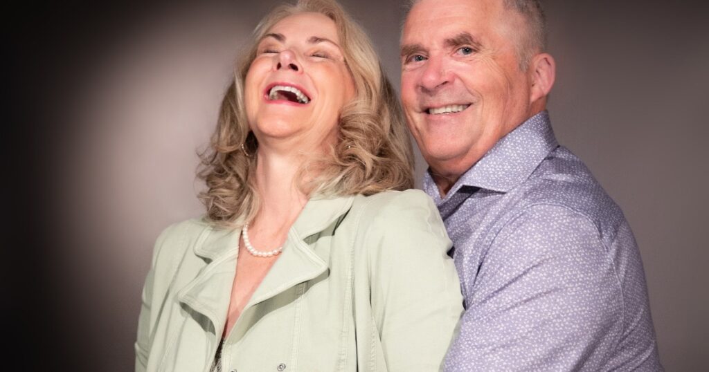 Anne and Brian Bercht laughing together 26 years after recovering from infidelity