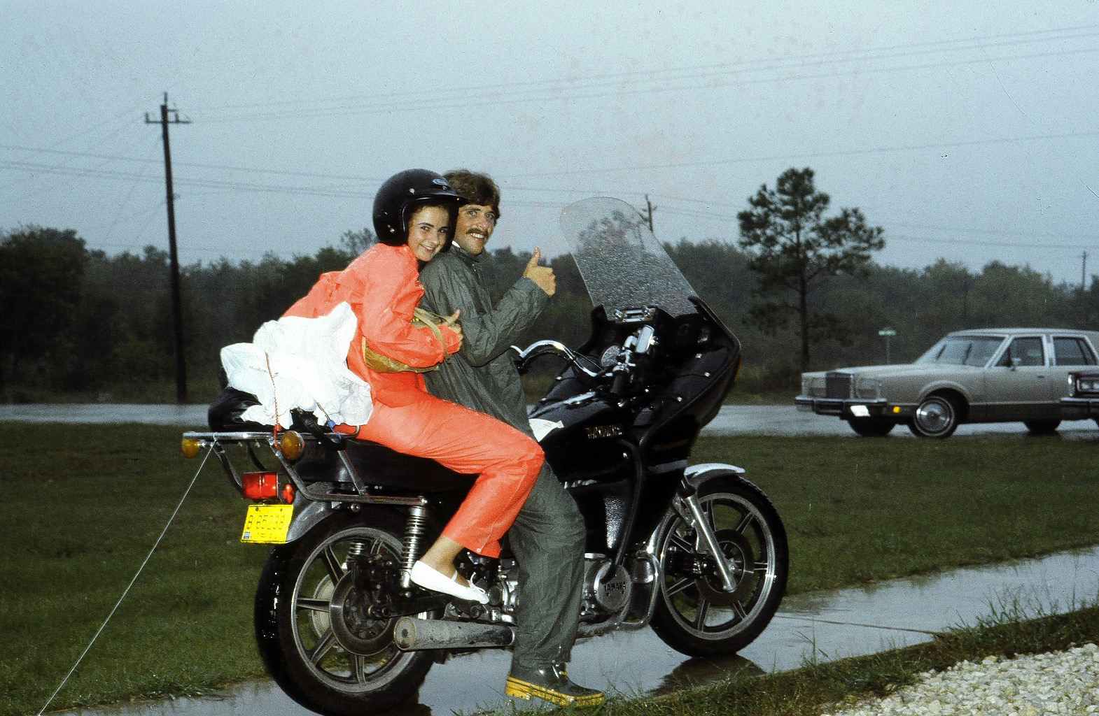 Anne and Brian Bercht on motorcycle after wedding