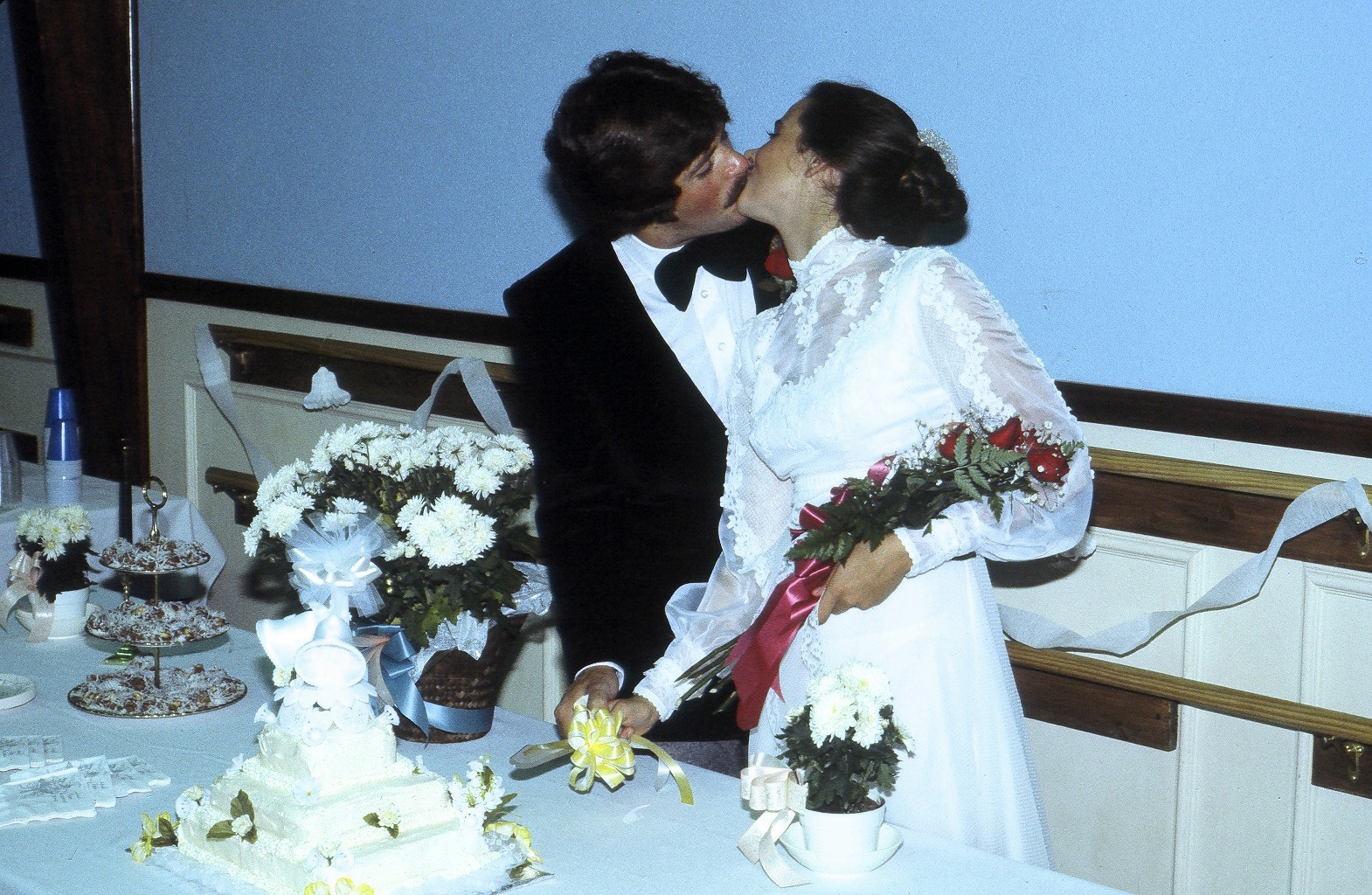 Anne and Brian Bercht kissing at their wedding